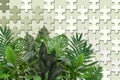 3d wallpaper texture, jigsaw puzzle pieces and green leaves on pastel color background