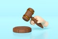 3d wooden judge gavel, hand holding hammer auction with stand isolated on blue background. law, justice system symbol concept, 3d Royalty Free Stock Photo