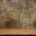 3D wooden table against a defocussed grunge background Royalty Free Stock Photo