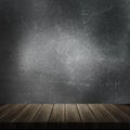 3D wooden table against a grunge metal background Royalty Free Stock Photo