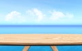 3D wooden table looking out to a blue ocean landscape Royalty Free Stock Photo