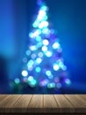 3D wooden table looking out to a defocussed Christmas tree Royalty Free Stock Photo