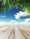 3D wooden table looking out to tropical ocean Royalty Free Stock Photo