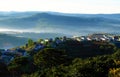 Residence, mountain chain with pine forest in foggy Royalty Free Stock Photo