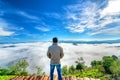 Silhouette young man standing on a high hill scenic rural hometown