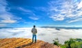 Silhouette young man standing on a high hill scenic rural hometown