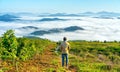 Silhouette young man standing on a high hill scenic rural hometown