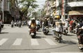 Commuters on motorcycles on a busy road in Da Nang