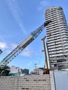 Da nang, Vietnam - February,10, 2026: A construction site features a tall building undergoing development. A large crane is Royalty Free Stock Photo