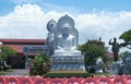 white marble buddha statue is displayed outside the stone sculpture factory in Da Nang.