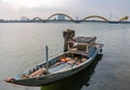 Sloop with Cau Rong or Dragon Bridge over Han River, Da Nang Vietnam Royalty Free Stock Photo