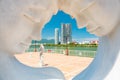 Da Nang, Vietnam: the Han River embankment, a view through a marble sculpture depicting a happy man & woman in love