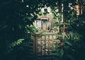 Dacha house with a wicket in a woods Royalty Free Stock Photo