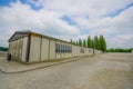 Dachau, Germany - July 30, 2015: Outside view long barrack building. part of concentration camp installations Royalty Free Stock Photo