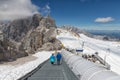 People going down at stairs to surface of Dachstein glacier
