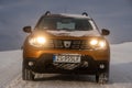 Dacia Duster SUV when driving on a snowy road Royalty Free Stock Photo
