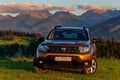 Dacia Duster SUV in the mountain wilderness during sunset Royalty Free Stock Photo