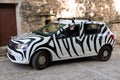 Dacia sandero white renault suv car with black animal paint or stickers covering zebra Royalty Free Stock Photo