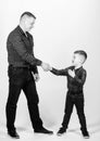 Dad and adorable child. Parenthood concept. Fathers day. Father example of noble human. Cool guys. Father little son red Royalty Free Stock Photo