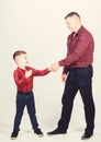 Dad and adorable child. Parenthood concept. Fathers day. Father example of noble human. Cool guys. Father little son red Royalty Free Stock Photo