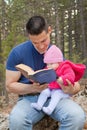 Dad and Baby Daughter Reading Bible