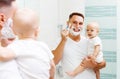 Dad and baby son shave