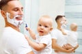 Dad and baby son shave