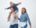 Dad, boy and shoulders for walk, family and smile together outdoor in sunshine with happiness. Father, mother and child Royalty Free Stock Photo