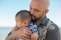 Father holding holding his little baby affectionately Royalty Free Stock Photo