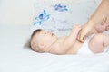 Dad changing diaper on baby girl on bed, changing nappy, everyday life Royalty Free Stock Photo