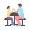 Dad competes with his son in arm wrestling. A man with a little boy is sitting on a bench at the table Royalty Free Stock Photo