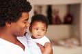 Dad Cuddling Baby Son At Home Royalty Free Stock Photo