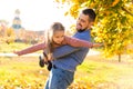 Dad and daughter in the autumn park play laughing Royalty Free Stock Photo