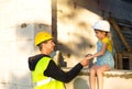 Dad and daughter are at construction site of their future home. The choice of the future profession of a builder is inherited by Royalty Free Stock Photo