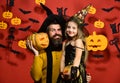 Dad and daughter in costumes. Girl and bearded man