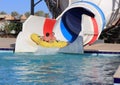 Dad and daughter fun, actively and emotionally ride on a roller coaster in the water park