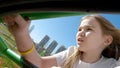 Dad and daughter go on thrill rides in amusement park. uncomfortable and painful