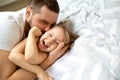 Dad and daughter have fun at home on the bed. Father`s Day. Royalty Free Stock Photo