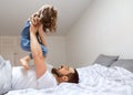 Dad and daughter have fun at home on the bed. Father`s Day Royalty Free Stock Photo