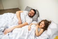 Dad and daughter have fun at home on the bed. Father`s Day. Royalty Free Stock Photo