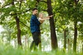 Dad and daughter have fun in park, girl flies with her father in his arms. Happy childhood Royalty Free Stock Photo