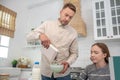 Dad and daughter in the kitchen at breakfast.