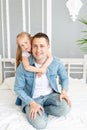 Dad and daughter play have fun playing or fooling around at home on the bed, happy family or father`s day Royalty Free Stock Photo