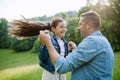 Dad with daughter, playing at meadow, running, having fun. Concept of fathers's Day and fatherly love. Royalty Free Stock Photo