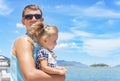 Dad and daughter playing on the promenade by the sea. young man, little girl Royalty Free Stock Photo