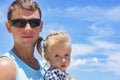 Dad and daughter playing on the promenade by the sea. young man, little girl Royalty Free Stock Photo