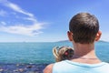 Dad and daughter playing on the promenade by the sea. young man, little girl Royalty Free Stock Photo