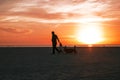 Dad and daughter at sunset on the beach