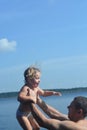 . Dad and daughter swim in the lake