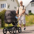 Dad drives his son in baby carriages